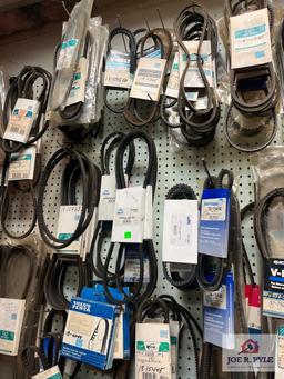 Assortment of Belts Hanging on Wall