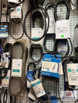 Assortment of Belts Hanging on Wall