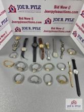 Assortment of watches with wooden holder