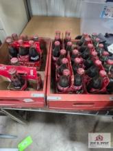 Collection of vintage unopened Coke bottles with box