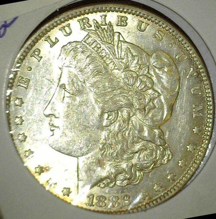 1882 P Morgan Silver Dollar, lightly toned High grade.