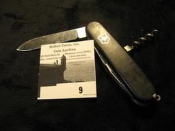 Black handled Swiss Army Knife with multi-tools.