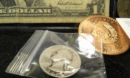 Series 1957 U.S. One Dollar Silver Certificate; 1964 P & 87 D Kennedy Half Dollars; One Ounce copper