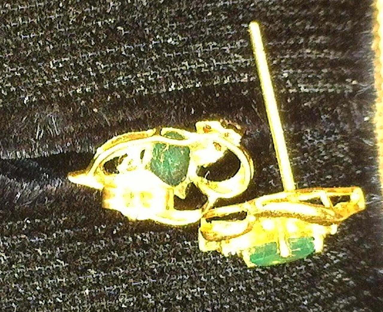 Diamond and Emerald 14K Gold Earrings. One is missing the back.