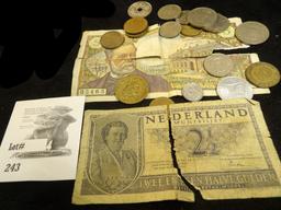 A ragged Netherlands 2 1/2 Gulden Note & a France Five Franc note as well as a selection of Foreign