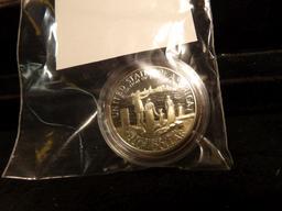 1986 S Statue of Liberty Proof Half Dollar in government capsule.