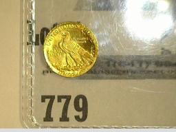 Tiny Indian design .13 gram Gold Coin in a plastic flip.