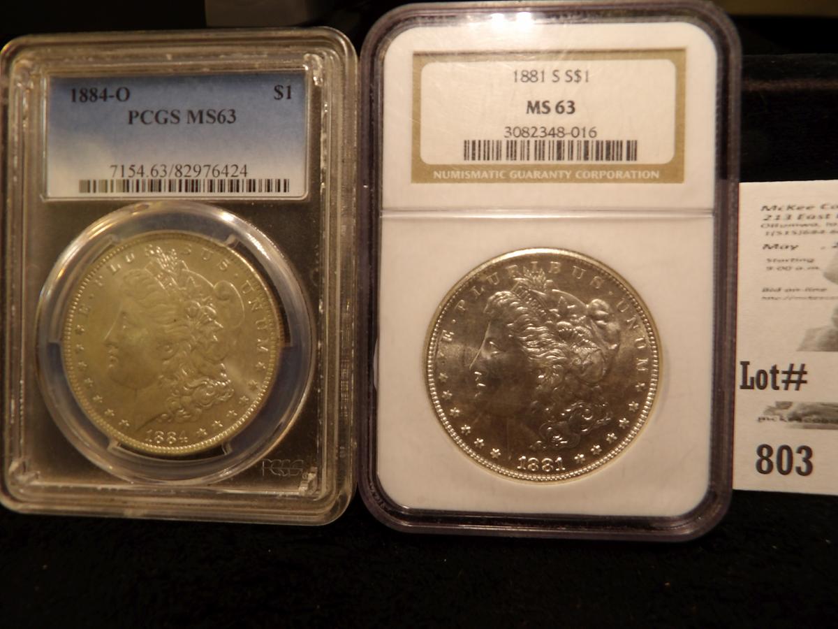 1881 S slabbed NGC MS63 & 1884 O slabbed PCGS MS63 Morgan Silver Dollars.