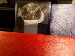 1976 Silver Bicentennial Uncirculated Three-piece Set; 1973 S Silver Uncirculated Eisenhower Dollar;