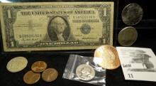 Series 1957 U.S. One Dollar Silver Certificate; 1964 P & 87 D Kennedy Half Dollars; One Ounce copper