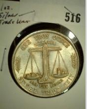 One Troy Ounce .999 Fine Silver, design is with flying Eagle and Balance scale.