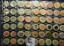 (60) various Wooden Nickels from Iowa in a pair of plastic pages.