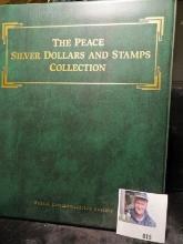 Album labeled "The Peace Silver Dollars and Stamps Collection", the album still contains the stamps