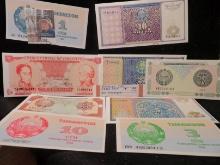 (9) Foreign Banknotes, all high grade. One is a Five Bolivares from the Republic of Venzuela, the ot