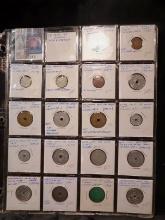 (18) Sales Tax Tokens in a plastic page. All different.