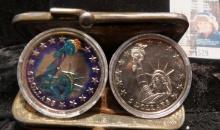 Leather two-pocket Coin purse with a pair of $5 Republic of Liberia Statue of Liberty crowns, one is