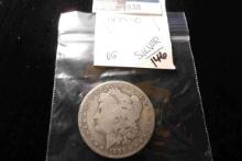 1899 O U.S. Morgan Silver Dollar, VG, carded.