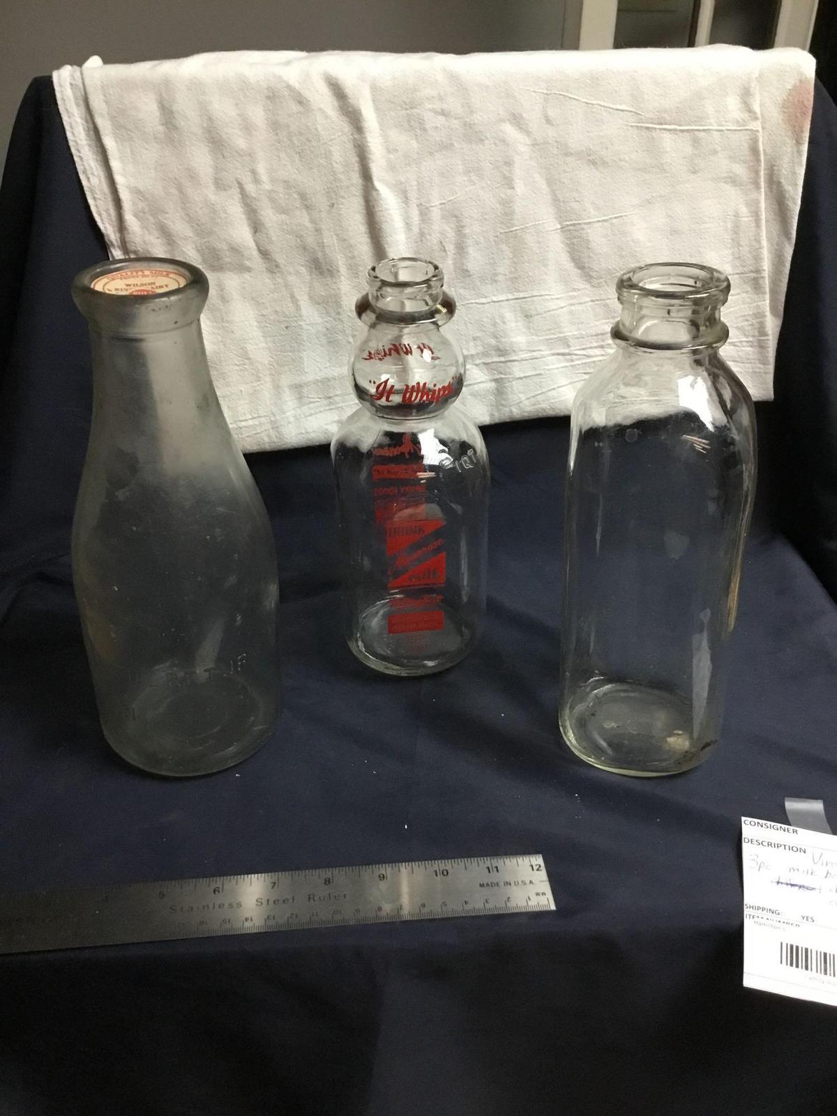 Vintage three-piece milk bottles different Dairies