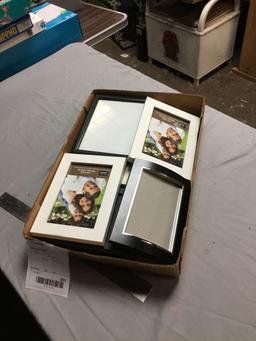 box of miscellaneous new frames