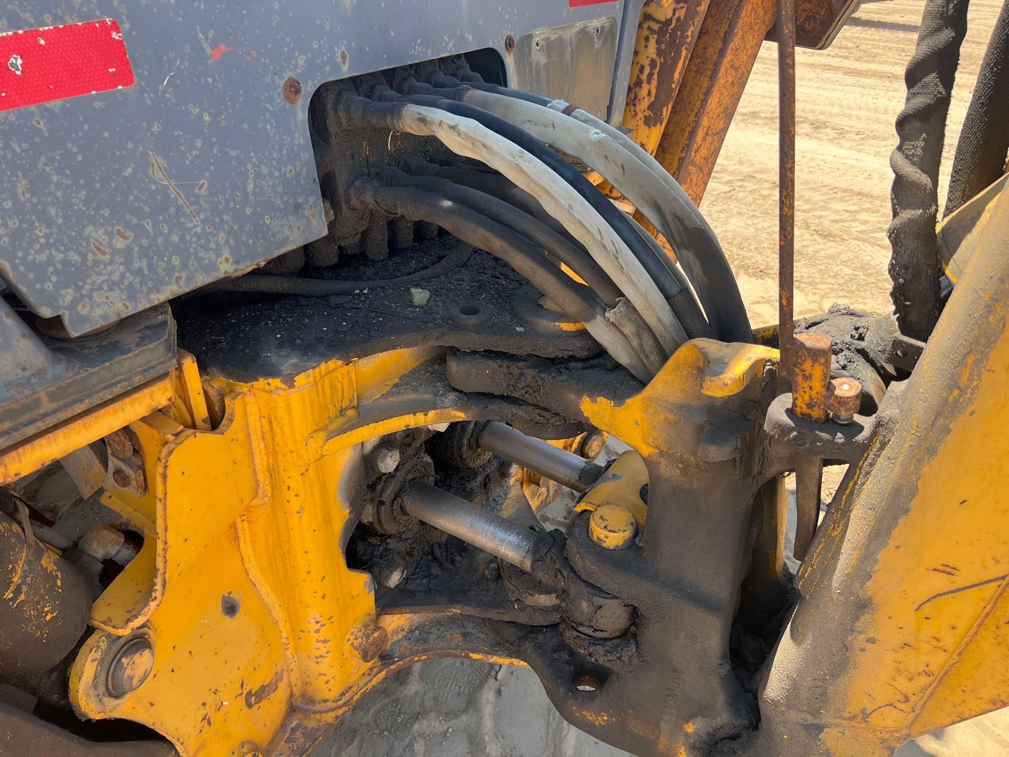 1990 JOHN DEERE 310C BACKHOE