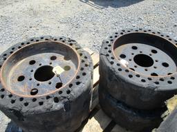 (4) Used 10-31 Solid Bobcat Tires & Wheels