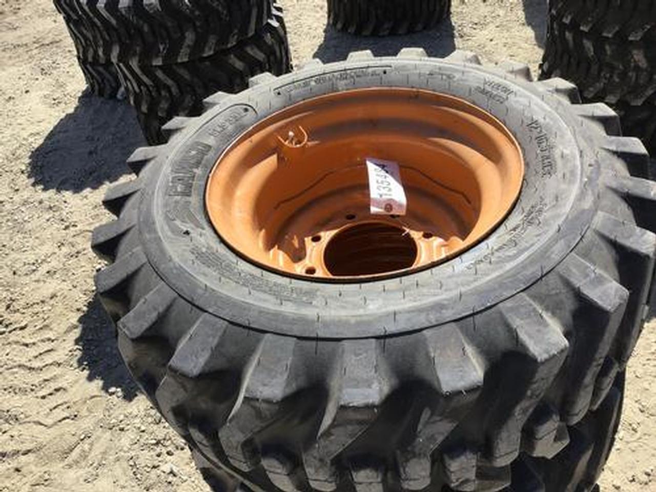 12-16.5 Skid Steer Tires on 8 Lug Rims