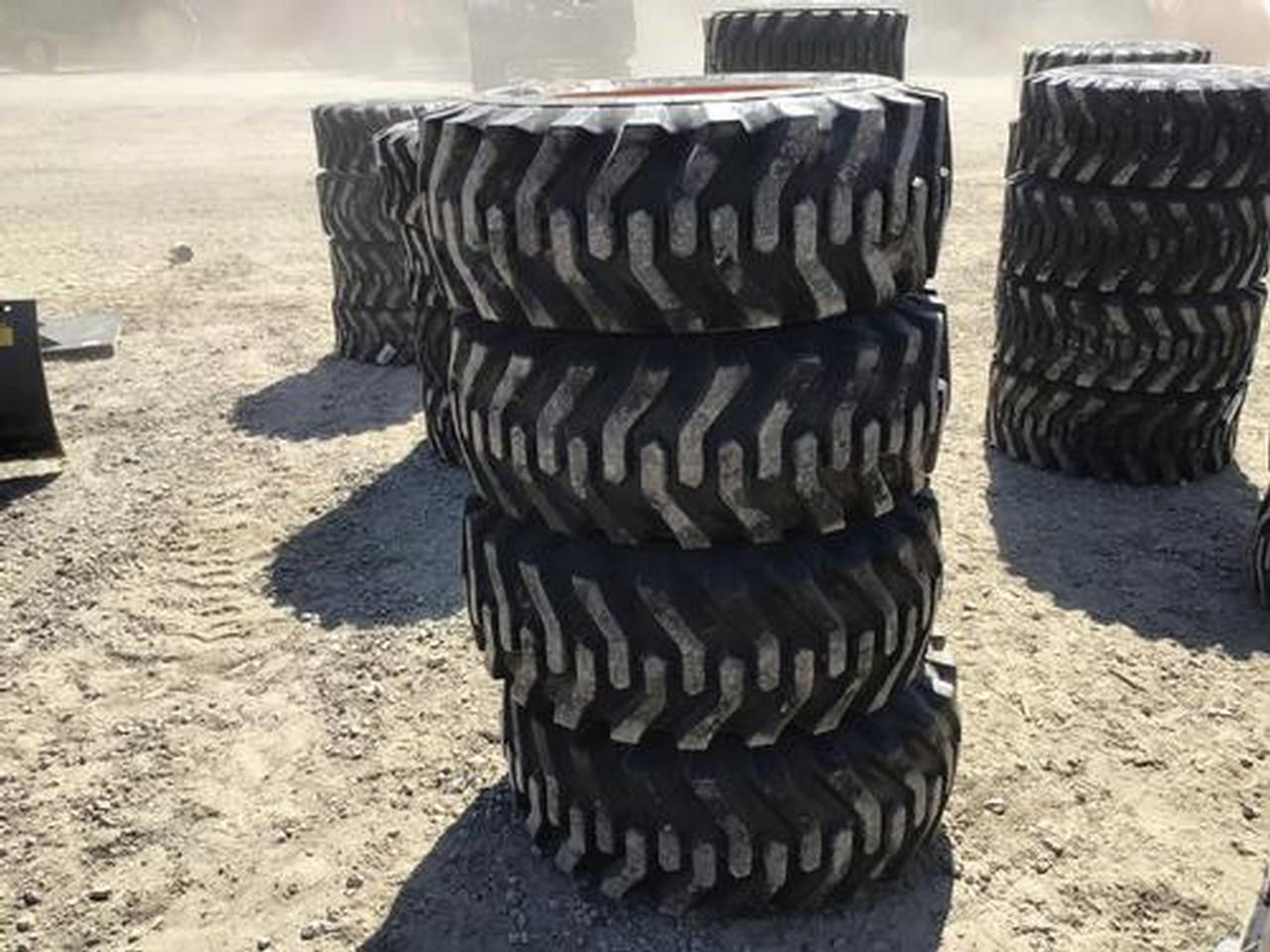 12-16.5 Skid Steer Tires on 8 Lug Rims