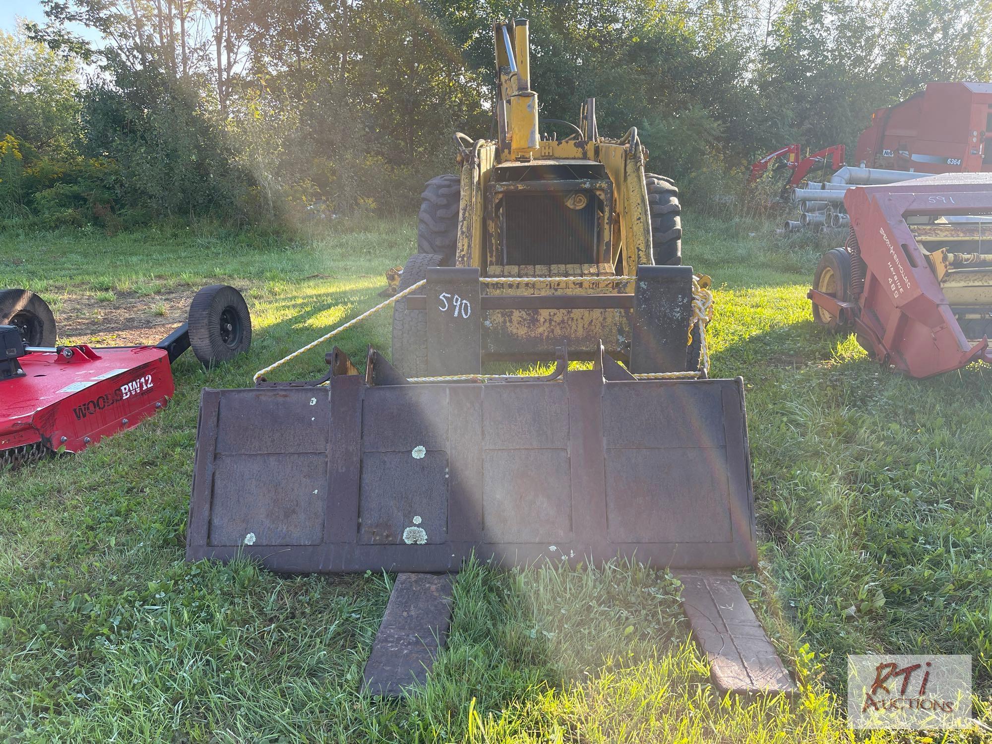 International 3414 diesel backhoe with forks and bucket