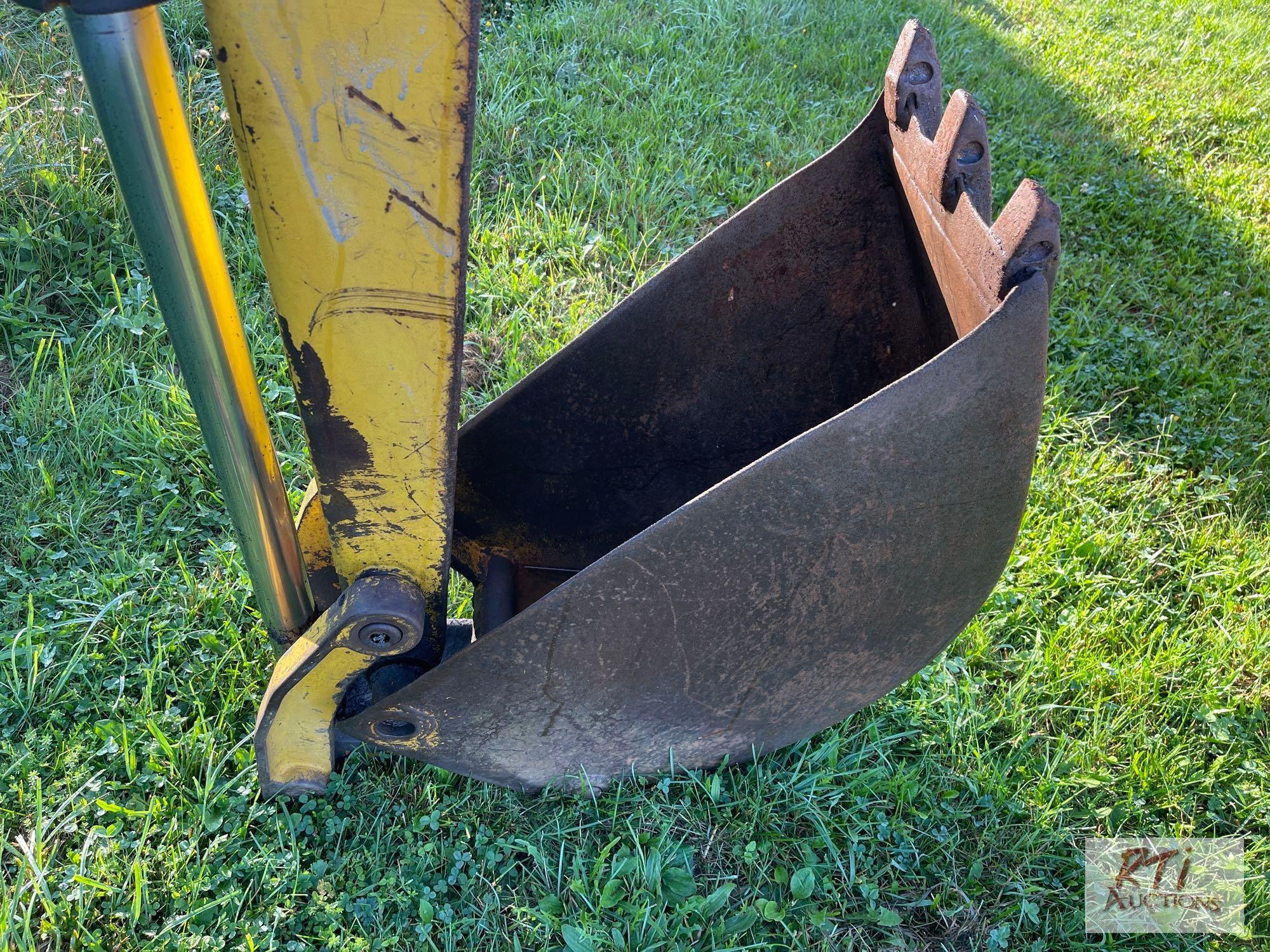 International 3414 diesel backhoe with forks and bucket
