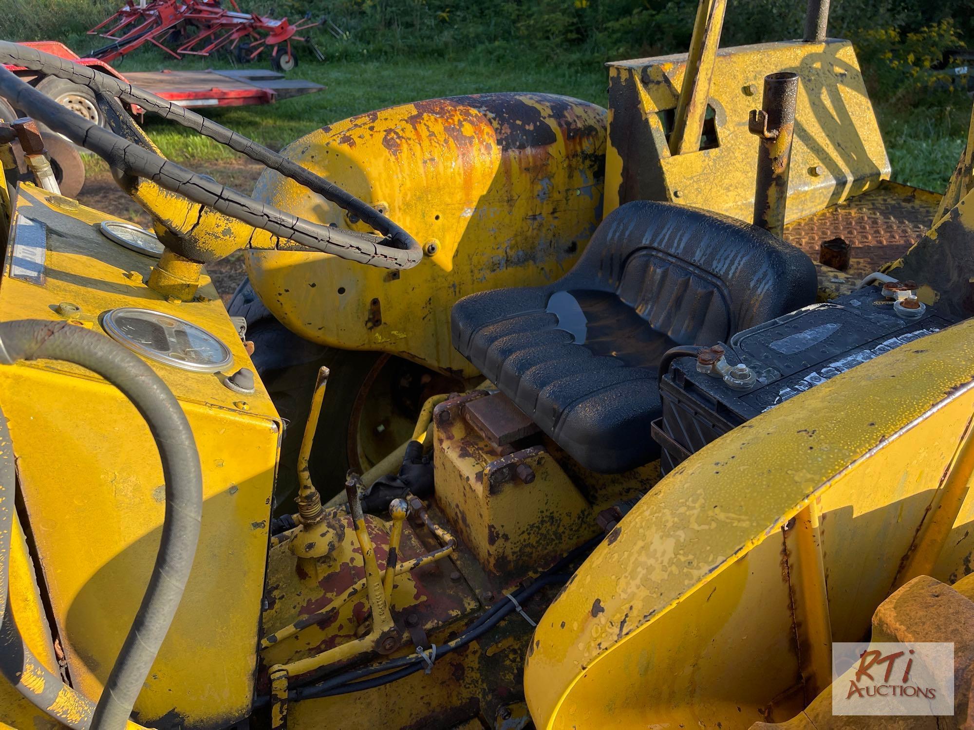 International 3414 diesel backhoe with forks and bucket