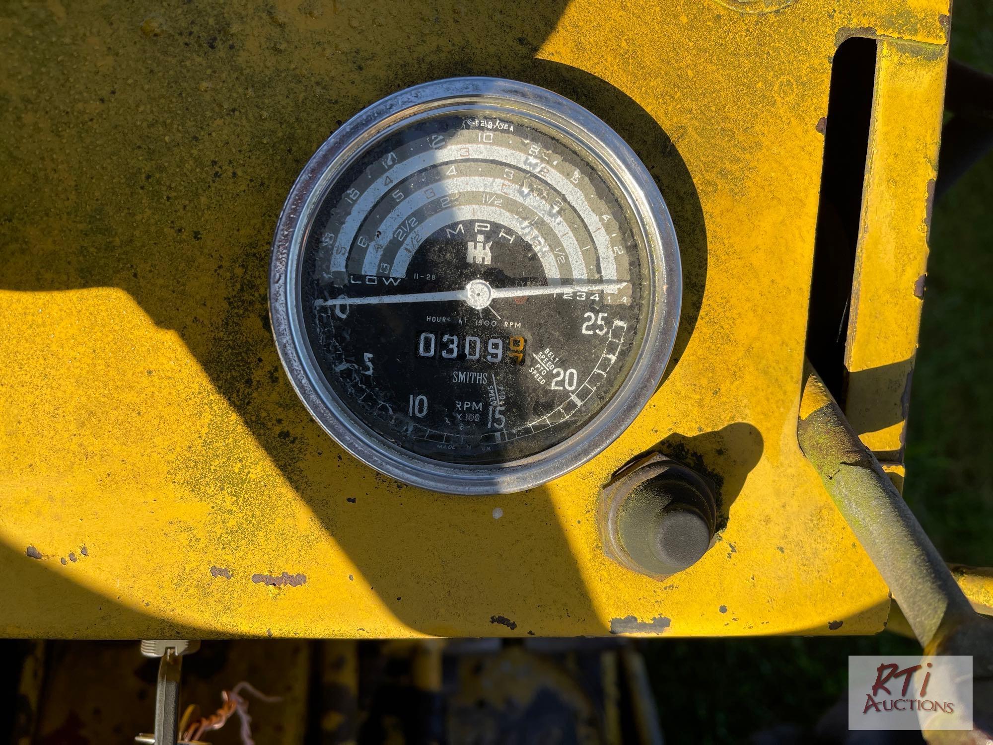 International 3414 diesel backhoe with forks and bucket