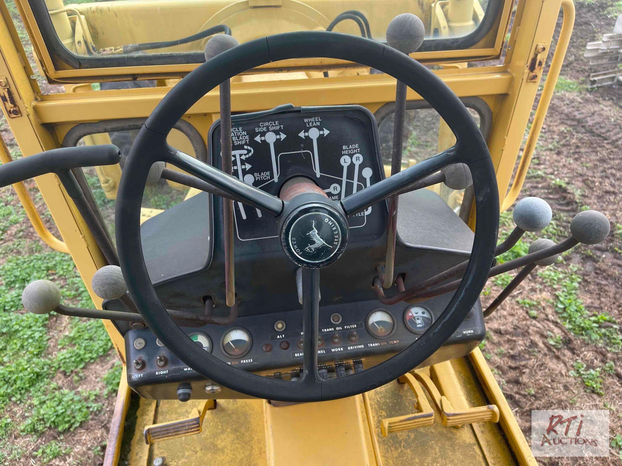 John Deere 570A grader, Runs and operates, 10' moldboard, Front scarifier