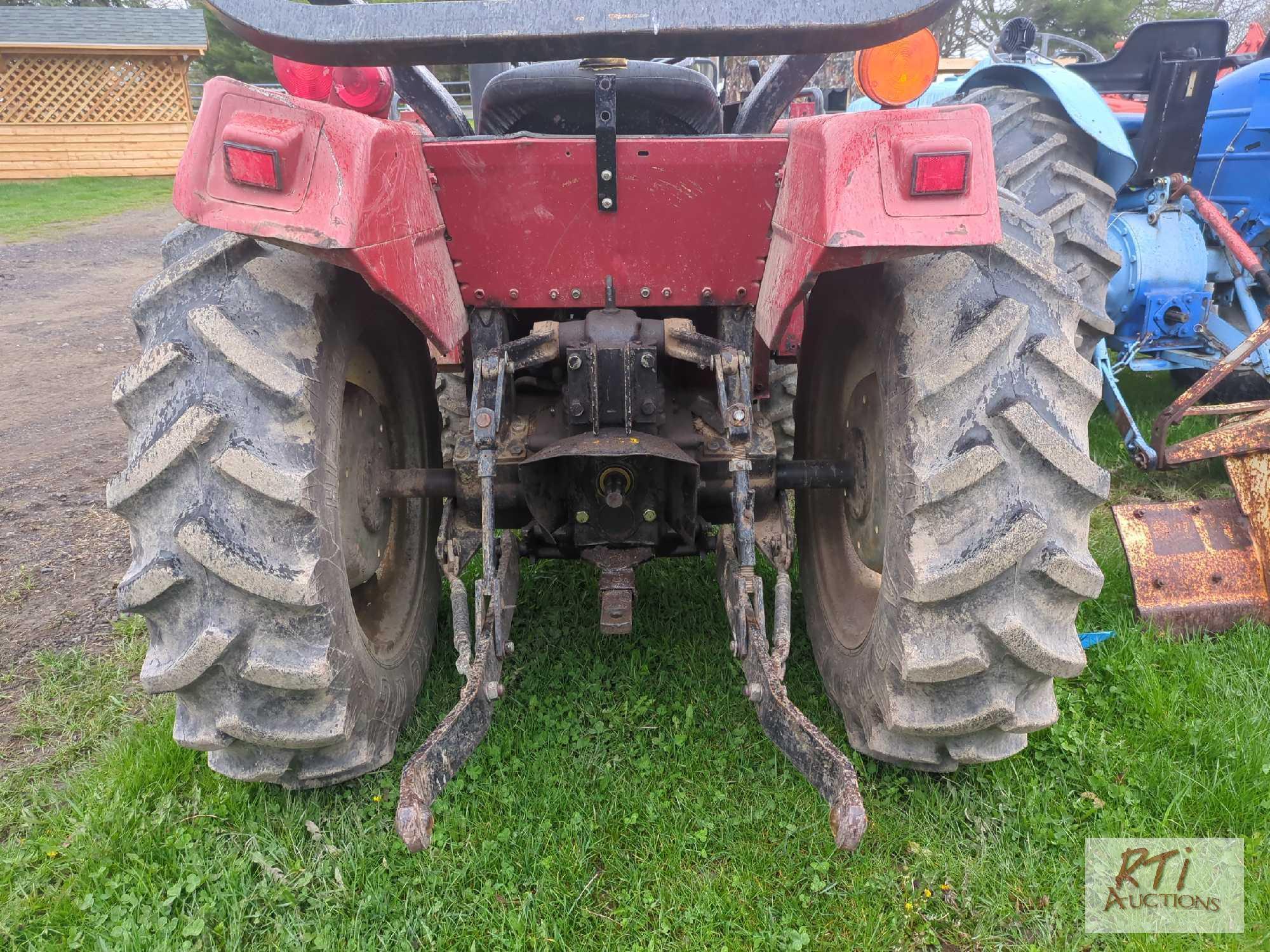 International 244 compact tractor, loader, GP bucket, lift arms, PTO, draw bar, differential lock,