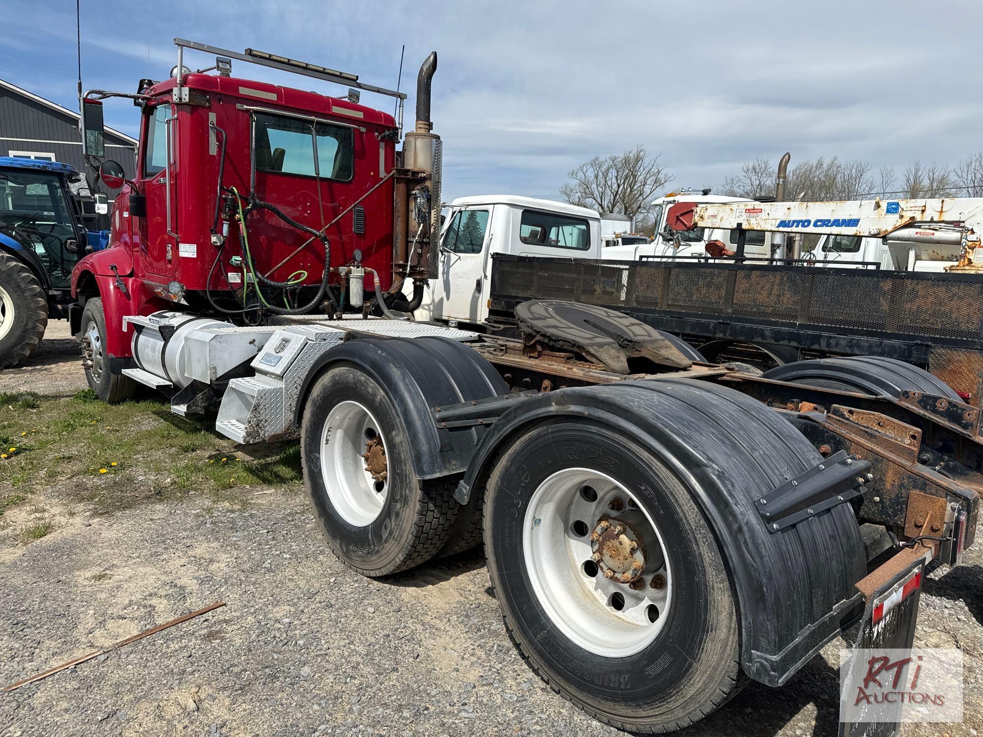 2013 International day cab tandem tractor with wetline, 18 speed, MaxxForce engine, 14K fronts, 46K