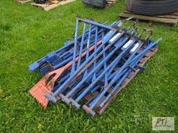 Pallet of scaffolding extensions with shingle shovel