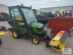 John Deere X758 lawn tractor, 4WD, 52in front hydraulic sweeper, rear spin spreader, Curtis cab, 574