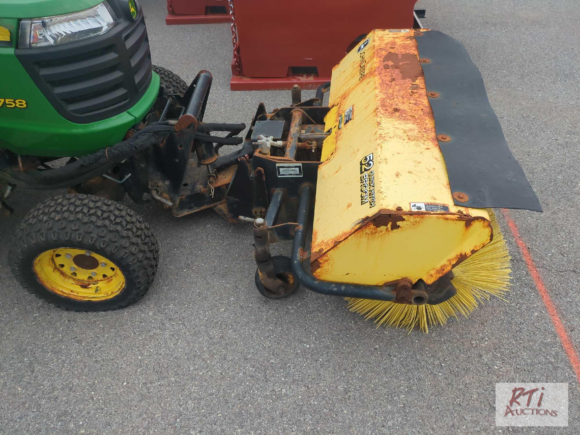 John Deere X758 lawn tractor, 4WD, 52in front hydraulic sweeper, rear spin spreader, Curtis cab, 574