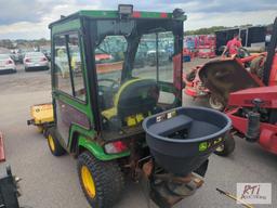 John Deere X758 lawn tractor, 4WD, 52in front hydraulic sweeper, rear spin spreader, Curtis cab, 574