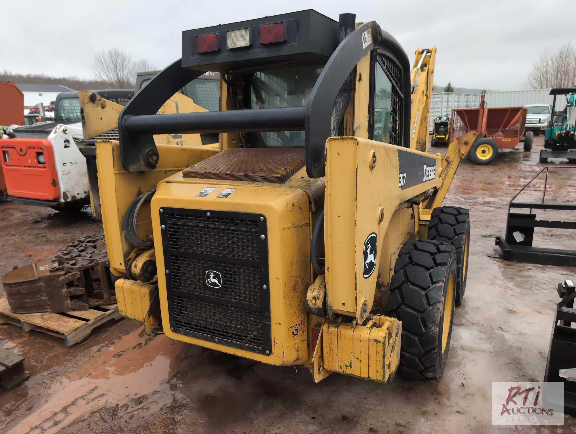John Deere 317 skid steer loader, cab, rear weights