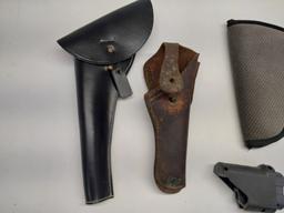 2 leather pistol holsters, 2 soft handgun cases