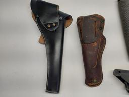 2 leather pistol holsters, 2 soft handgun cases