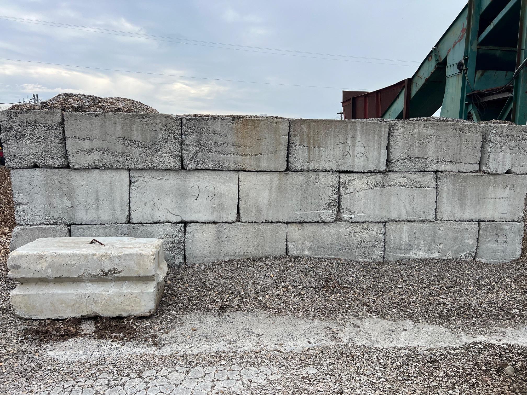 APPROX 60 CONCRETE CONTAINMENT BLOCK