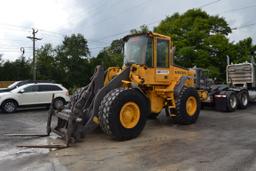 VOLVO L70E ARTICULATING WHEEL LOADER W/ QUICK ATTACH W/ FORKS W/ ENCLOSED CAB W/ 20.5X25 RUB 21,821