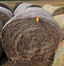 4 Round Bails Of Hay.
