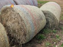 2 Round Bails Of Hay.