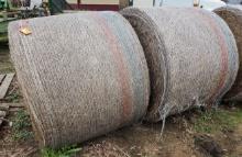 2 Round Bails Of Hay.