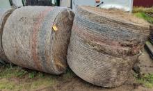 2 Round Bails Of Hay.