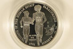 1995-P US PF SILVER $1 OLYMPIC RUNNING. IN HARD