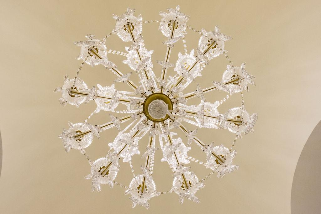 Brass and glass chandelier  2 tier , 18 light w/prisms and swags,  Approx.