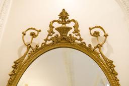 Beveled mirror Oval w/crest, rope and swag carving